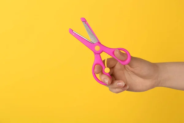 Woman Holding Small Scissors Yellow Background Closeup Space Text — Stock Photo, Image