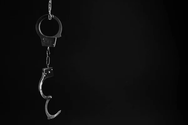 Classic Chain Handcuffs Hanging Black Background Space Text — Stock Photo, Image