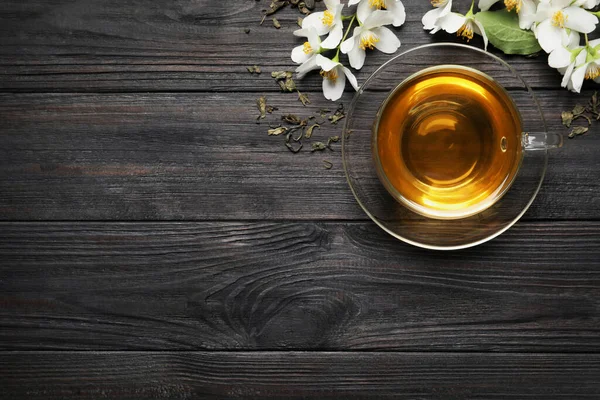 Glass Cup Aromatic Jasmine Tea Dry Leaves Fresh Flowers Black — Stock Photo, Image