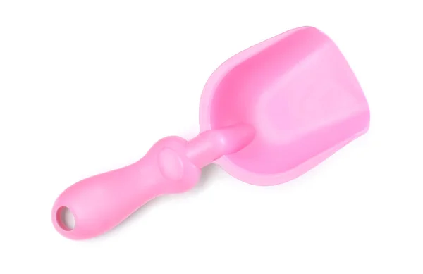 白で隔離されたピンクのプラスチック製のおもちゃのシャベル トップビュー — ストック写真