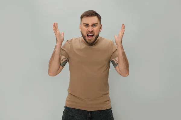 Angry Young Man Grey Background Hate Concept — Stock Photo, Image