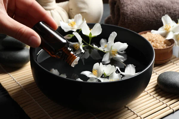 Woman Dripping Jasmine Essential Oil Bowl Table Closeup — Stock Photo, Image