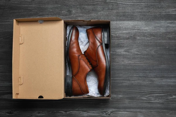 Stylish Men Shoes Cardboard Box Wooden Floor Top View Space — Stock Photo, Image