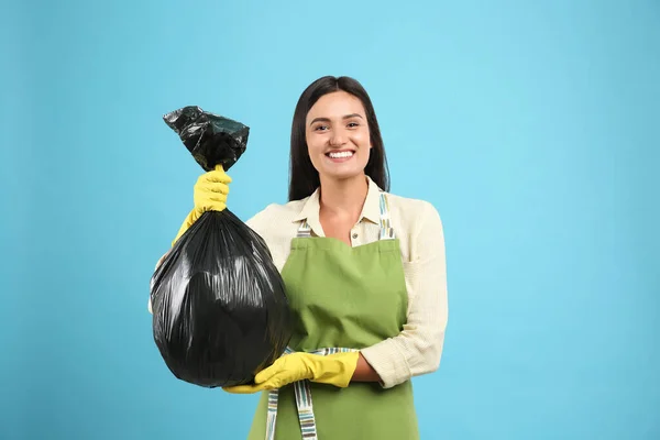 Woman Holding Full Garbage Bag Light Blue Background — Stock Photo, Image