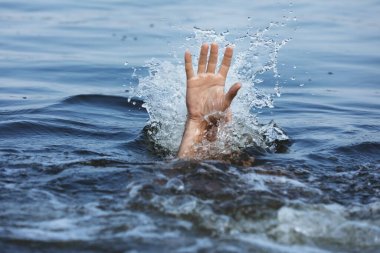 Drowning man reaching for help in sea, closeup clipart