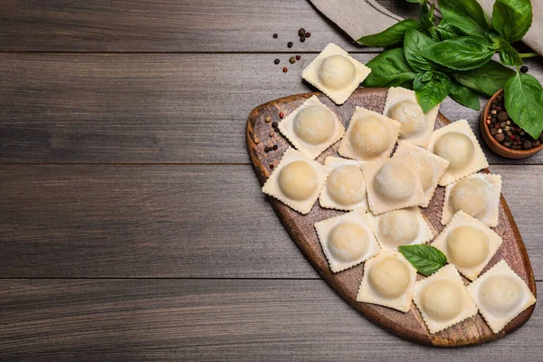 Uncooked Ravioli Basil Peppercorns Wooden Table Flat Lay Space Text — Stock Photo, Image