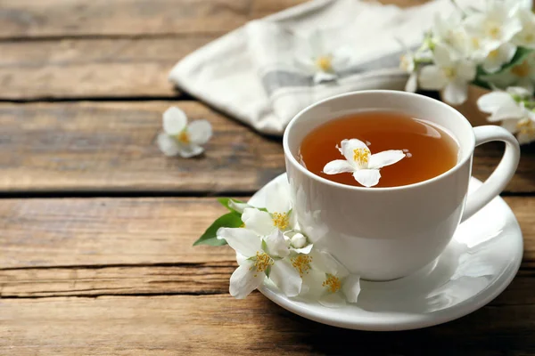 Cup Aromatic Jasmine Tea Fresh Flowers Wooden Table Space Text — Stock Photo, Image