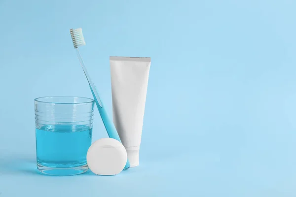 Mouthwash Toothbrush Paste Dental Floss Light Blue Background Space Text — Stock Photo, Image