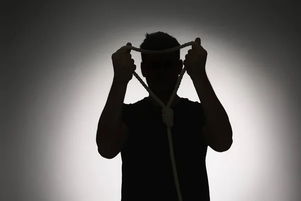 Silhouette Dell Uomo Con Cappio Corda Sfondo Chiaro — Foto Stock