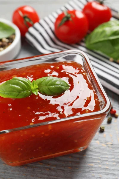 Spicy Chili Sauce Basil Grey Wooden Table Closeup — Stock Photo, Image