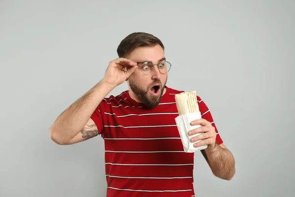 Emotional Young Man Delicious Shawarma Grey Background — Stock Photo, Image