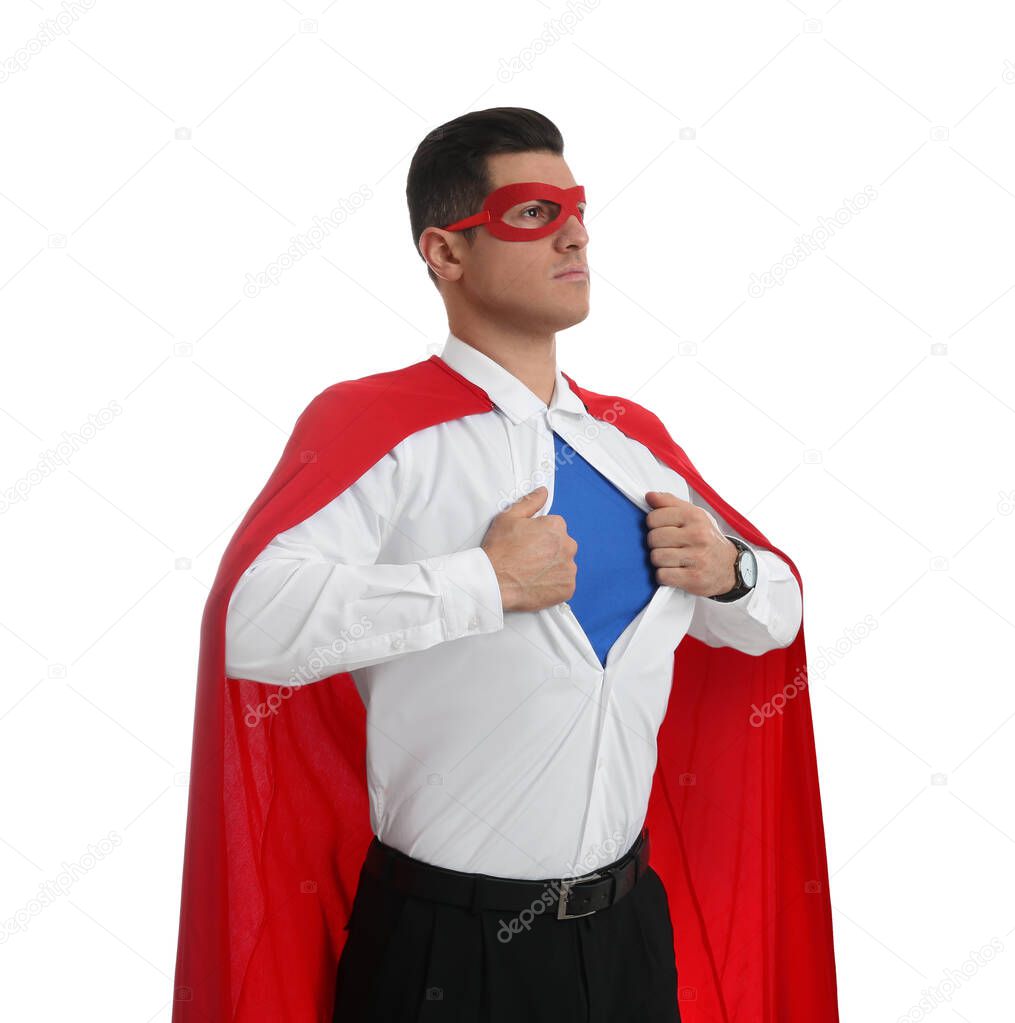 Businessman in superhero cape and mask taking shirt off on white background