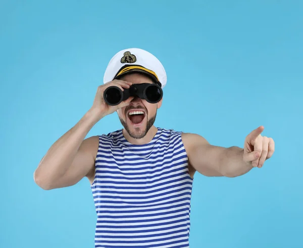 Sailor Looking Binoculars Pointing Light Blue Background — Stock Photo, Image