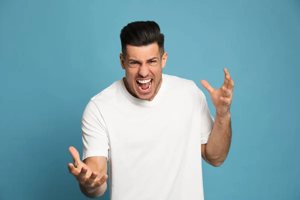 Angry Man Turquoise Background Hate Concept — Stock Photo, Image