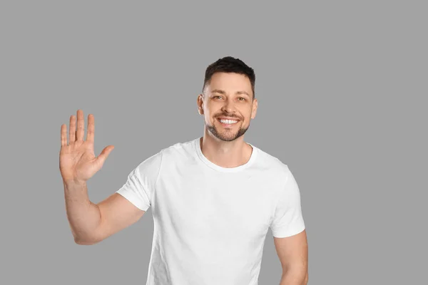 Cheerful Man Waving Say Hello Light Grey Background — 스톡 사진