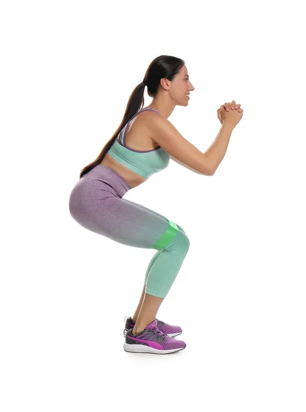 Vrouw Doet Hurken Met Fitness Elastiek Witte Achtergrond — Stockfoto