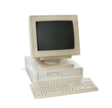 Old computer monitor, system unit and keyboard on white background
