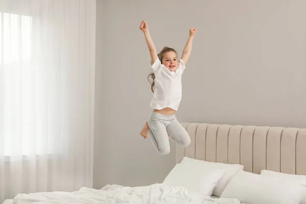 Cute Little Girl Jumping Bed Home — Stock Photo, Image