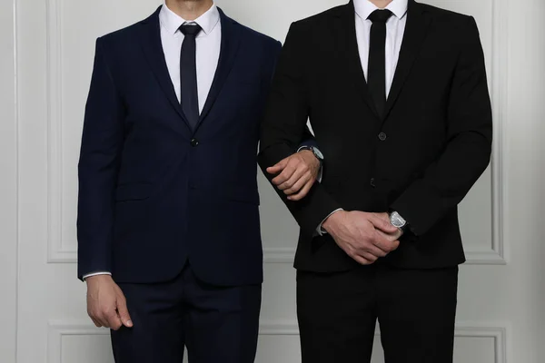 Gay Couple Elegant Suits Standing White Wall Closeup — Stock Photo, Image