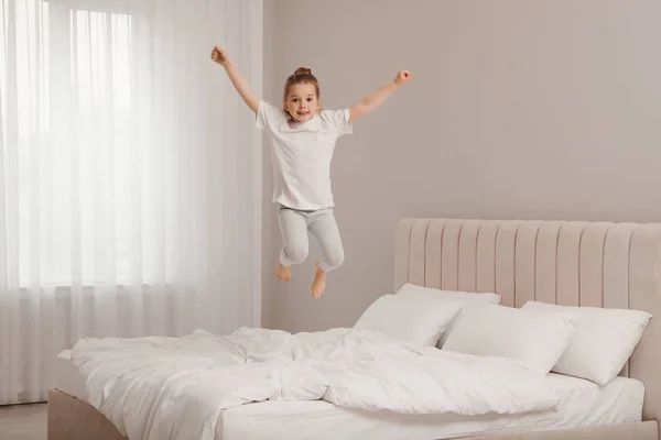 Cute Little Girl Jumping Bed Home — Stock Photo, Image