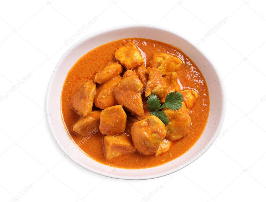 Bowl of delicious chicken curry on white background, top view