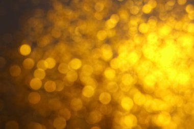Arka plan olarak altın ışıkların bulanık görüntüsü. Bokeh etkisi