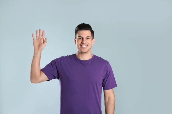 Cheerful Man Waving Say Hello Grey Background — Stock Photo, Image