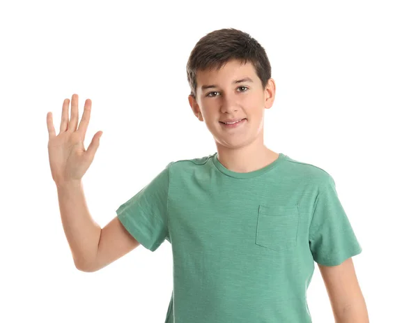 幸せな十代の男の子手を振って挨拶に白い背景 — ストック写真