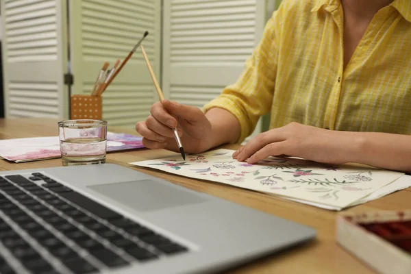 Woman drawing picture at online art lesson indoors, closeup. Distant learning