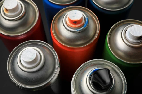 Cans Different Graffiti Spray Paints Black Background Closeup — Stock Photo, Image