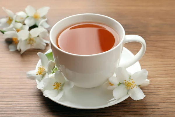 Cup Aromatic Jasmine Tea Fresh Flowers Wooden Table — Stock Photo, Image