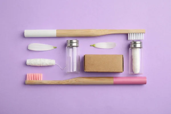Flat Lay Composition Sustainable Dental Flosses Bamboo Toothbrushes Violet Background — Stock Photo, Image