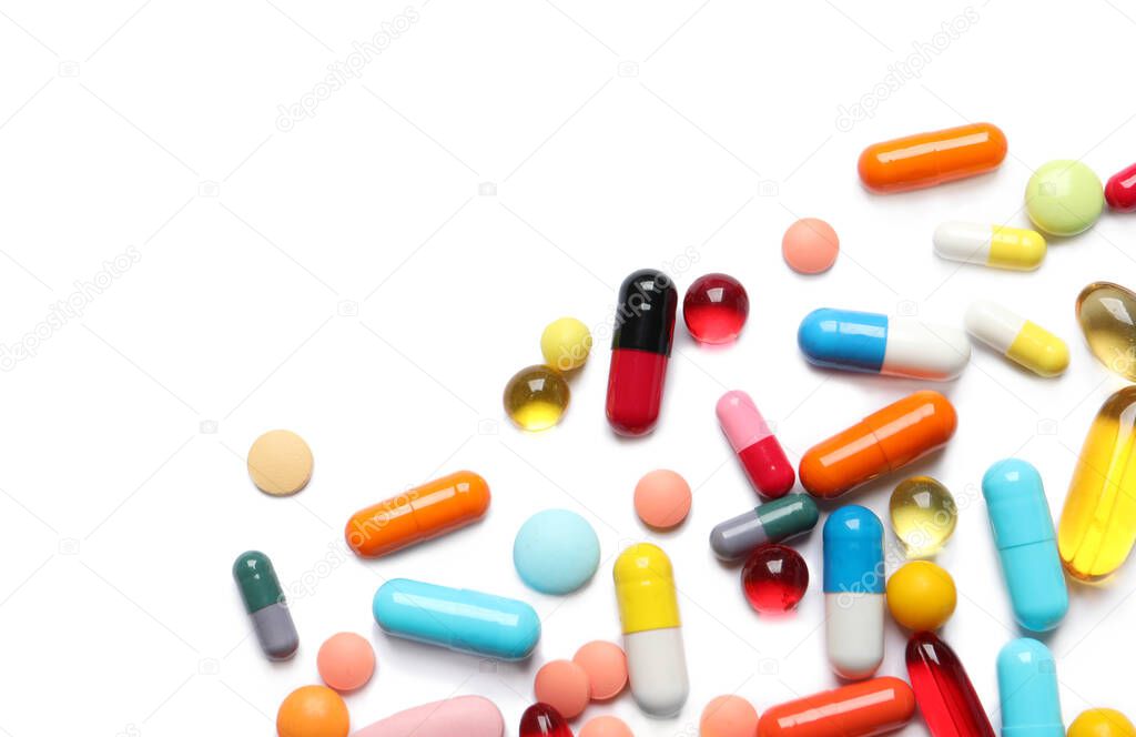 Lots of different colorful pills isolated on white, top view