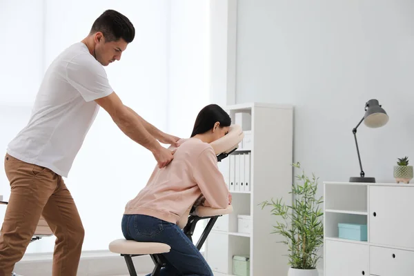 Woman Receiving Massage Modern Chair Indoors — Stock Photo, Image
