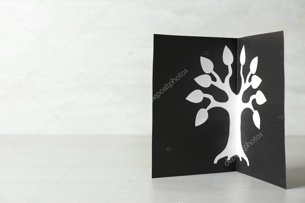 Card with family tree template on light wooden table. Space for text