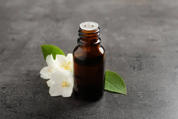 Essential Oil Jasmine Flowers Grey Table Closeup — Stock Photo, Image