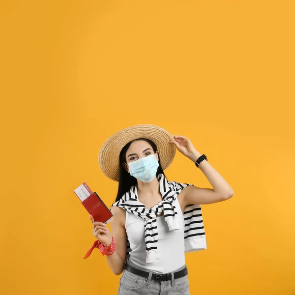 Female Tourist Medical Mask Ticket Passport Yellow Background Travelling Coronavirus — Stock Photo, Image