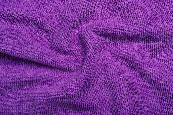 折皱的紫色微纤维布作为背景 — 图库照片