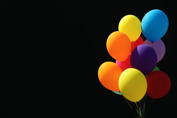 Stelletje Kleurrijke Ballonnen Zwarte Achtergrond Ruimte Voor Tekst — Stockfoto