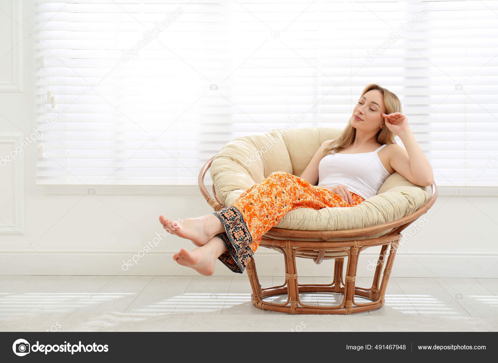 Beautiful Young Woman Relaxing Papasan Chair Home Space Text Stock Photo by  ©NewAfrica 491467948