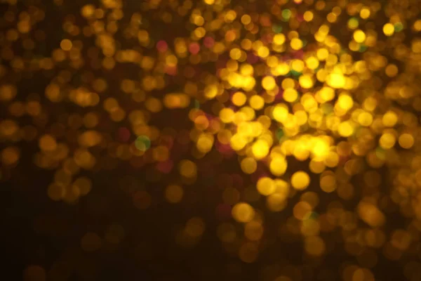 Blurred View Golden Glitter Dark Background Bokeh Effect — Stock Photo, Image