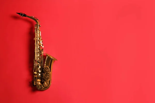 Beautiful Saxophone Red Background Top View Space Text — Stock Photo, Image