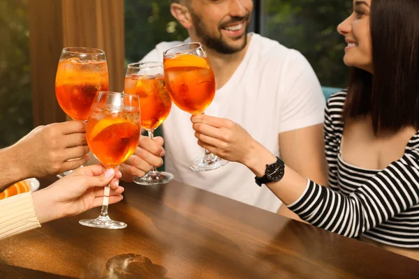 Friends Clinking Glasses Aperol Spritz Cocktails Table Closeup — Stock Photo, Image