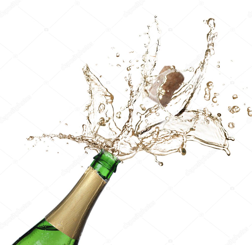 Sparkling wine splashing out of bottle on white background