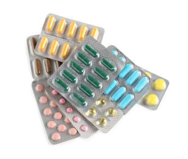 Beyaz arka planda farklı haplarla kabarcıklar, üst görünüm