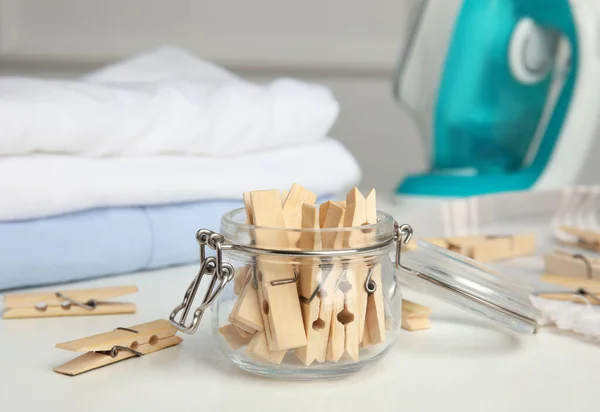 Many Wooden Clothespins Glass Jar White Table — Stock Photo, Image