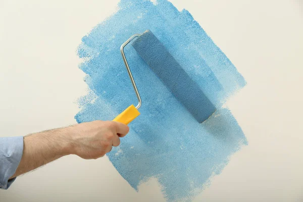 Man Applying Light Blue Paint Roller Brush White Wall Closeup — Stock Photo, Image