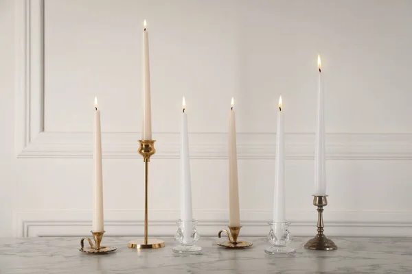 Elegant Candlesticks Burning Candles White Marble Table — Stock Photo, Image