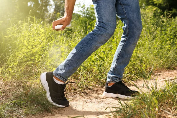 Man Spraying Tick Repellent Leg Hike Nature Closeup — Stock Photo, Image