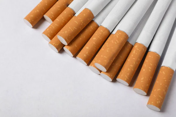 Pile Cigarettes Orange Filters White Background View Space Text — Stock Photo, Image